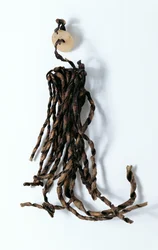 Tassel with pierced round disc, found with the Oetzi Iceman